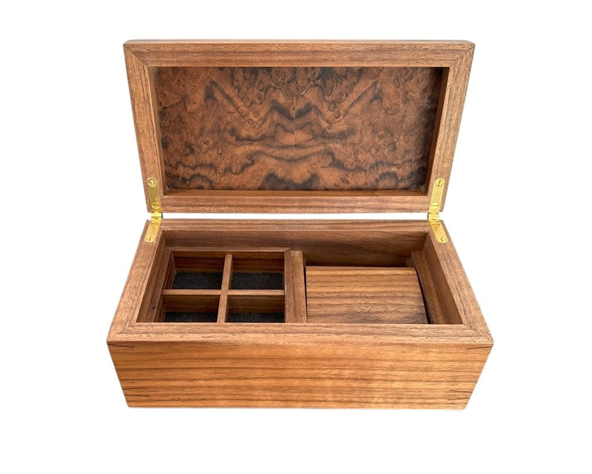 Handcrafted luxury burr walnut watch box with a watch roll, four cufflink compartments and another compartment underneath.