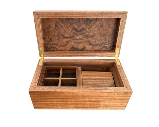 Handcrafted luxury burr walnut watch box with a watch roll, four cufflink compartments and another compartment underneath.